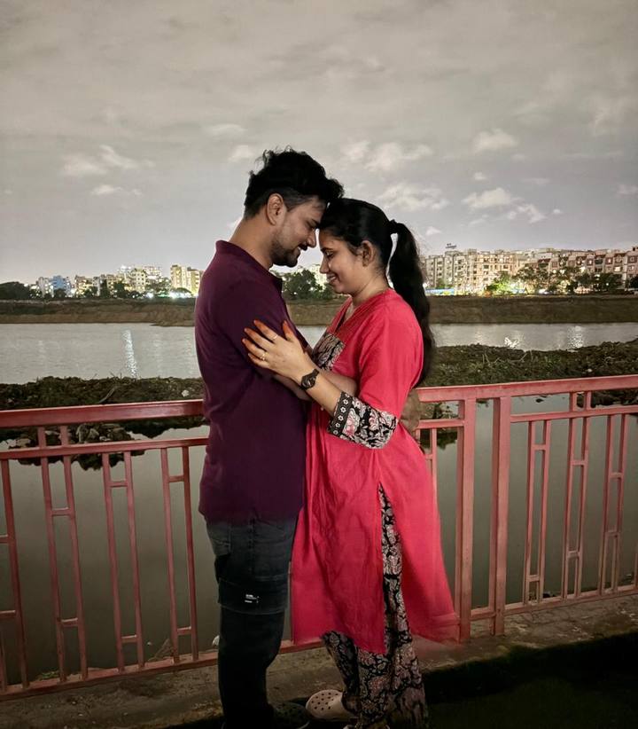 Lakshmi and Srinivas together by the lake